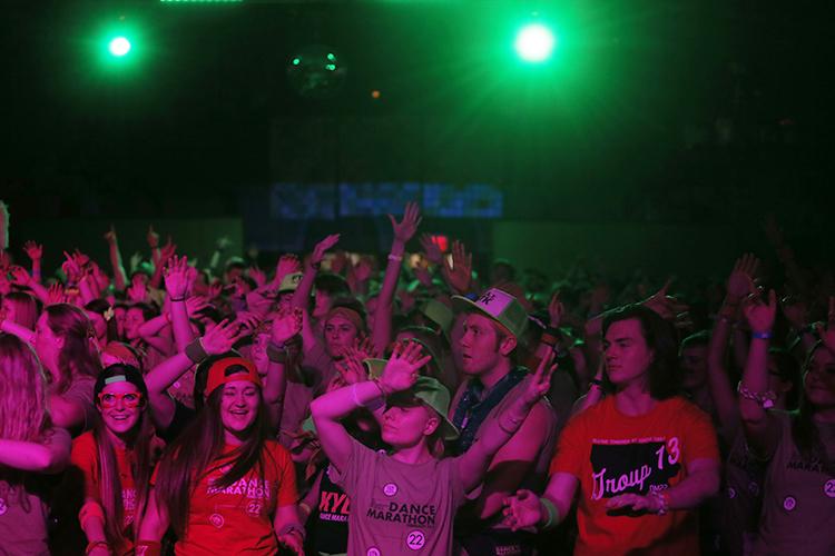 The crowd sways with DJs during the fifth hour of the 22nd Dance Marathon in the Iowa Union Memorial on Saturday, Feb. 6, 2016. Dance Marathon dancers cant sleep through the whole 24 hours of the marathon. (The Daily Iowan/Courtney Hawkins)