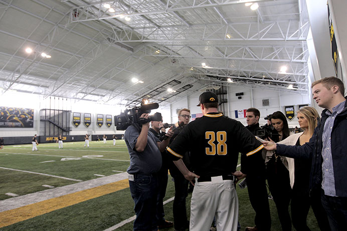 Tyler Peyton, Senior, talks to press during media day in the Richard O. Jacobsen Football Operations building on Feb. 11, 2016. Peyton, a prized pitcher, recently declined an offer to pay for the Cincinnati Reds team. (The Daily Iowan/Mary Mathis)