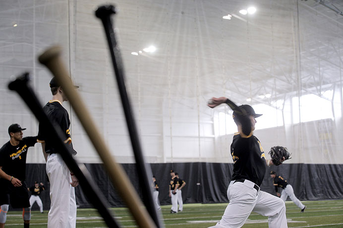 Kyle Wade, RS Freshman, throws to his partner during media day inside the Richard O. Jacobsen Football Operations building on Feb. 11, 2016. Wade spent the summer rehabilitating from Tommy John surgery. (The Daily Iowan/Mary Mathis)