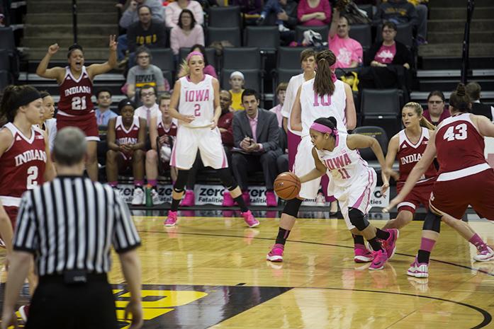 Iowas No. 11, Tania Davis drives past the Indiana defense at the Carver-Hawkeye Arena in Iowa City, Iowa on Sunday, Feb. 21, 2016. The Hawkeyes beat the Hoosiers 76-73 in front of a home crowd of 9,838. (The Daily Iowan/Ting Xuan Tan)