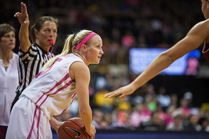 Iowa Guard Whitney Jennings looks for an open teammate while feeling pressure from Indiana during the Womens Basketball game against Indiana at Carver-Hawkeye Arena on Sunday Feb. 21, 2016. The Hawkeyes beat the Hoosiers 76-73 in front of a home crowd of 9,838. (The Daily Iowan/Anthony Vazquez)