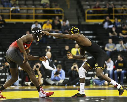 Iowa's Edwin Cooper Jr. moves toward North Carolina State's Tommy Gantt at 157 pounds during the NWCA National Duels Championship Series on Monday, Feb. 22. 2016 in Carver-Hawkeye.  Gantt defeated Cooper Jr., 13-5 in a major decision. (The Daily Iowan/Brooklynn Kascel)