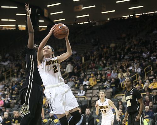 Iowa guard Ally Disterhoft goes up for a basket against a Purdue defender in Carver-Hawekeye on Thursday, Feb. 18. The Hawkeyes defeated the Boilermakers 63-55. (The Daily Iowan/ Alex Kroeze)