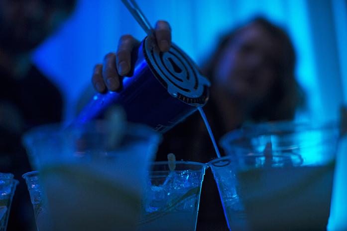 Becca Breazeale, a bartender from Forbinnen Planet, pours cocktails during Top Chef inside Hotel Vetro in Iowa City on Monday, Feb. 29, 2016. The award for Best Mixologist went to Mickys Irish Pub. (The Daily Iowan/Brooklynn Kascel)