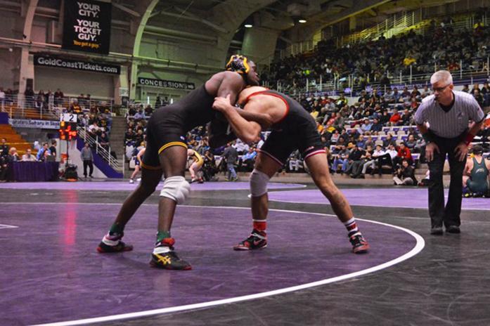 Iowa 157-pounder Edwin Cooper Jr. wrestles against Rutgers John Van Brill during the 53rd Annual Midland Championships at Welsh-Ryan Arena in Evanston, IL on Wednesday, Dec. 30, 2015. (The Daily Iowan/Valerie Burke)