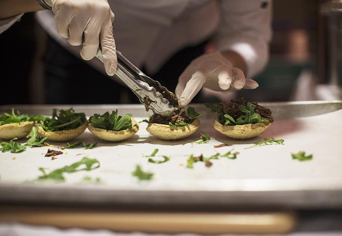 Andrea Raimondi, Executive Chef at The University Club, assembles a dish during Top Chef inside Hotel Vetro in Iowa City on Monday, Feb. 29, 2016. A panel of culinary experts awared the title of "Top Chef" to Pullman Bar &amp; Diner. (The Daily Iowan/Brooklynn Kascel)
