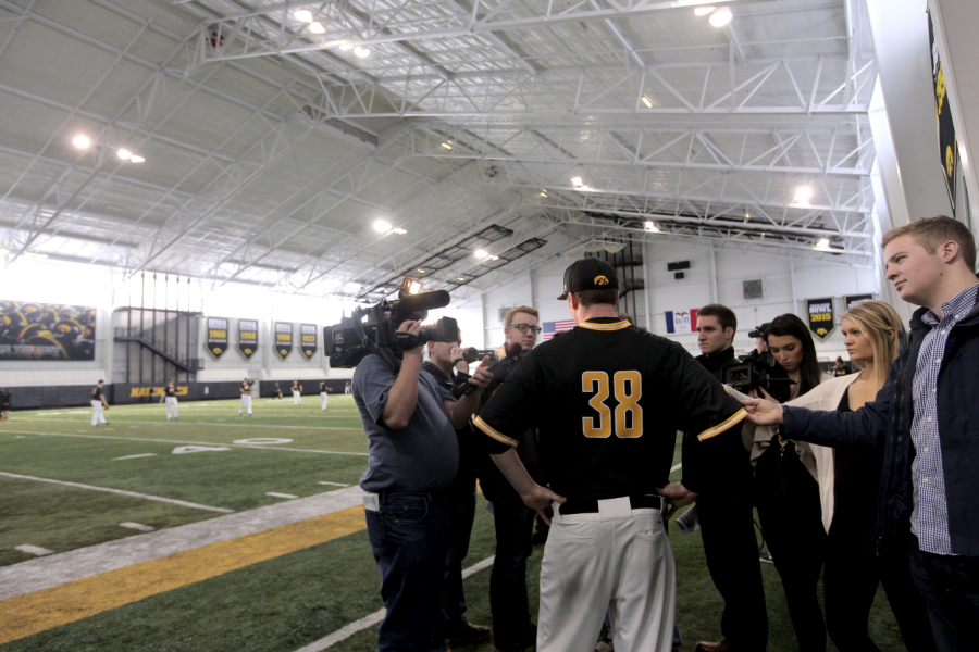 Hawkeye Tyler Peyton talks to press during media day in the Jacobson Football Operations Building on Thursday. Peyton, a prized pitcher who also plays first base, declined an offer to play for the Cincinnati Reds in order to return to Iowa. (The Daily Iowan/Mary Mathis)