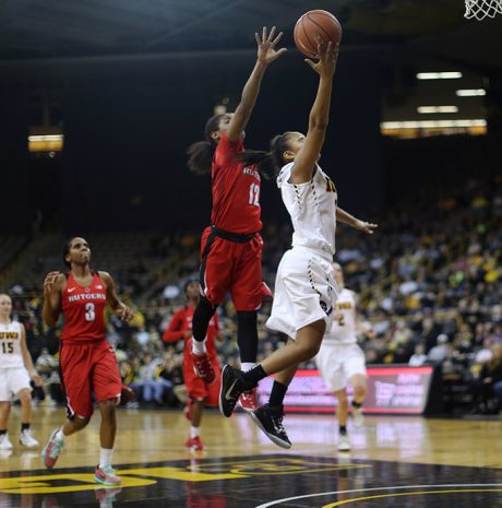 Iowa guard Tania Davis goes up for a layup against Rutgers Khadaizha Sanders during the Iowa-Rutgers game in Carver-Hawkeye Arena on Monday, Jan. 4, 2016. The Hawkeyes defeated the Scarlet Knights, 69-65. (The Daily Iowan/Margaret Kispert)