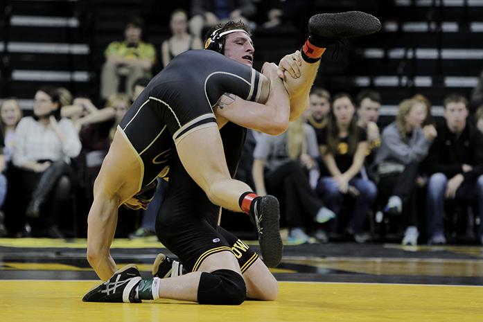 Sammy Brooks scored 12-4 in a major decision against Boilermaker Tanner Lynde. The Hawkeyes are ranked #2 in the league. (Daily Iowan/Karley Finkel)