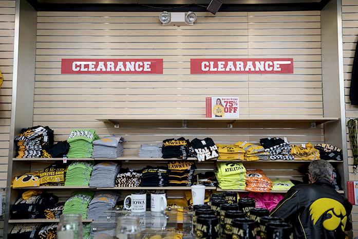 Customers visit Universitees, Old Capitol Town Center, on Wednesday, Feb. 24, 2016. Universitees is having big sale before they close. They will be closing when the product runs out or when their lease ends at March 31, 2016. (The Daily Iowan/Peter Kim)