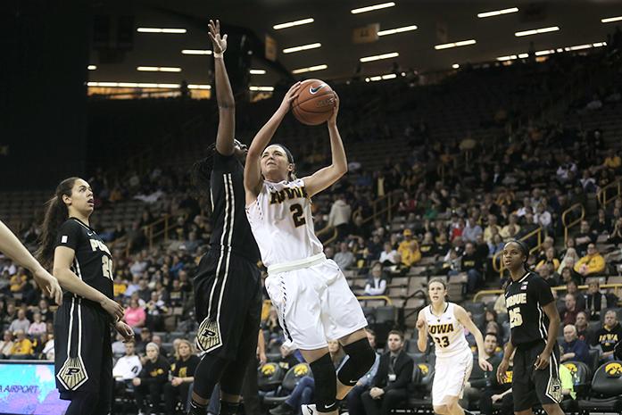 Iowa guard Ally Disterhoft goes up for the a basket against a Purdue defender on Thursday Feb. 18, 2106. The Hawkeyes defeated the Boilermakers 63-55 in Carver Hawkeye Arena. (The Daily Iowan/ Alex Kroeze)