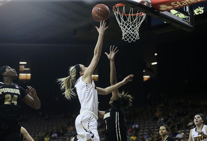 Iowa guard Ally Disterhoft goes for a layup over a stretched out Purdue defender on Thursday Feb. 18, 2106. The Hawkeyes defeated the Boilermakers 63-55 in Carver Hawkeye Arena. (The Daily Iowan/ Alex Kroeze)