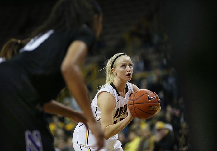 Iowa guard Whitney Jennings prepairs to shoot a free throw during the Iowa-Northwestern game in Carver-Hawkeye Arena on Wednesday, Jan. 14, 2014. Jennings had 10 points and 6 assists to help the Hawkeyes beat the Wildcats, 83-70. (The Daily Iowan/Margaret Kispert)