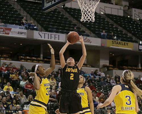 Iowa guard Ally Disterhoft drives during the Women's Big Ten Tournament in Indianapolis on Thursday. The Hawkeyes defeated the Wolverines, 97-85, and will play No. 1 seed Maryland  at 11 a.m. CST. (The Daily Iowan/Margaret Kispert)