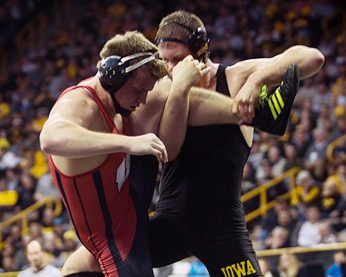 Iowa's 197-pounder Nathan Burak attempts a leg takedown against Wisconsin's Eric Peissig during the first round of the Big Ten Championships at Carver-Hawkeye Arena on Saturday, March 5, 2016. Iowa's Burak defeated Peissig with a technical fall in 6:53. (The Daily Iowan/Anthony Vazquez)