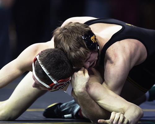 Iowa's 133-pounder Cory Clark isolates the arm of Ohio State's Johnni DiJulius during the first round of the Big Ten Championships at Carver-Hawkeye Arena on Saturday, March 5, 2016. Iowa's Clark defeated Dijulius in a decision 7-3. (The Daily Iowan/Anthony Vazquez)