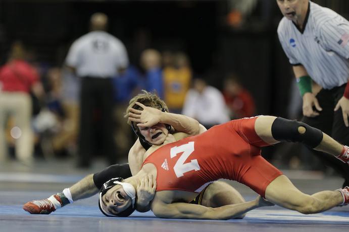Iowa 133-pounder Cory Clark grapples against Nebraskas Eric Montoya during the quarterfinals of the NCAA Championships at Madison Square Garden in New York City on Friday, March 18, 2016. Clark defeated Montoya, 4-0. (The Daily Iowan/Valerie Burke)