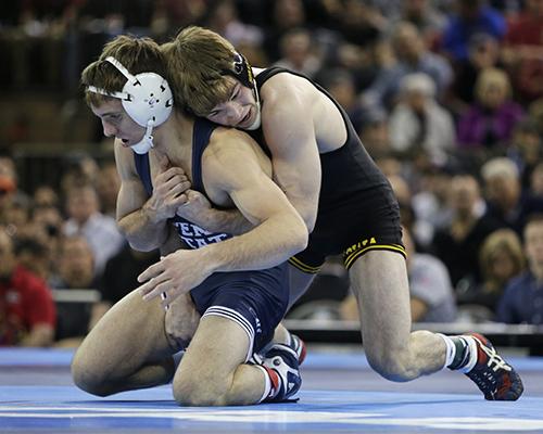 Iowa 149-pounder Brandon Sorensen wrestles against Penn States Zain Retherford during the NCAA Championship finals at Madison Square Garden in New York City on Saturday, March 19, 2016. Rutherford defeated Sorensen, 10-1. (The Daily Iowan/Valerie Burke)