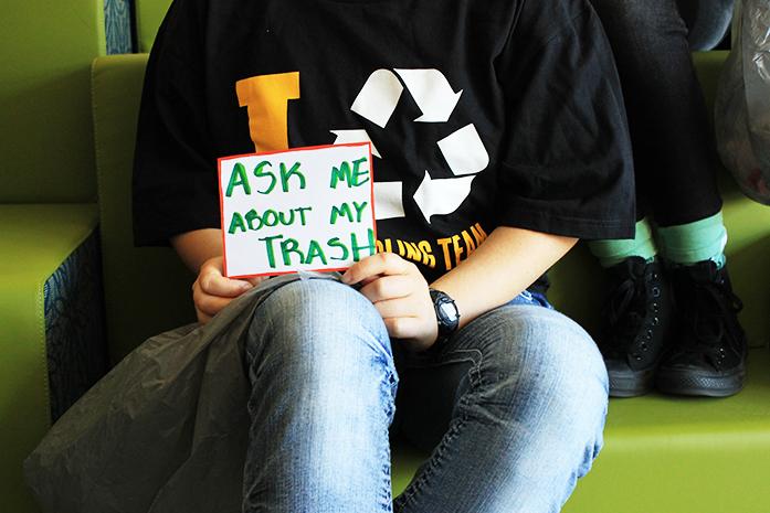 FILE - Recycle Mania Intern Elana Becker kicks off Earth Month in the Office of Sustainability on Monday, March 28, 2016. The Office of Sustainability just ended Recycle Mania, and is encouraging students to carry their trash bags over their backs around campus this week as a way to raise awareness of how much trash a single person can produce. (The Daily Iowan/file)