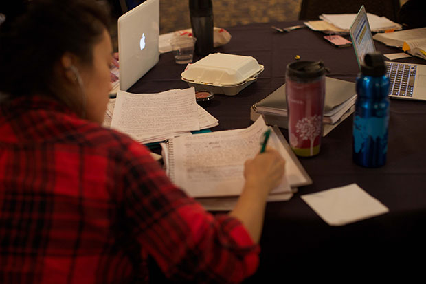 A UI student studies at the IMU for upcoming finals on Sunday, Dec. 14, 2014. The IMU provides students with a number of events and free things to relieve finals stress, including coffee, popcorn, and massages. (The Daily Iowan/Mikaela Parrick)