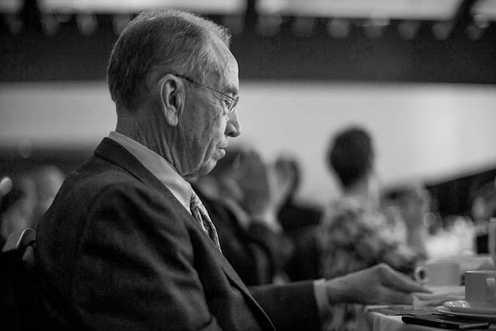 FILE - Sen. Chuck Grassley, R-Iowa, listens to a speech being delivered at the Lincoln Dinner in Des Moines on Saturday, May 16, 2015. (The Daily Iowan/file)