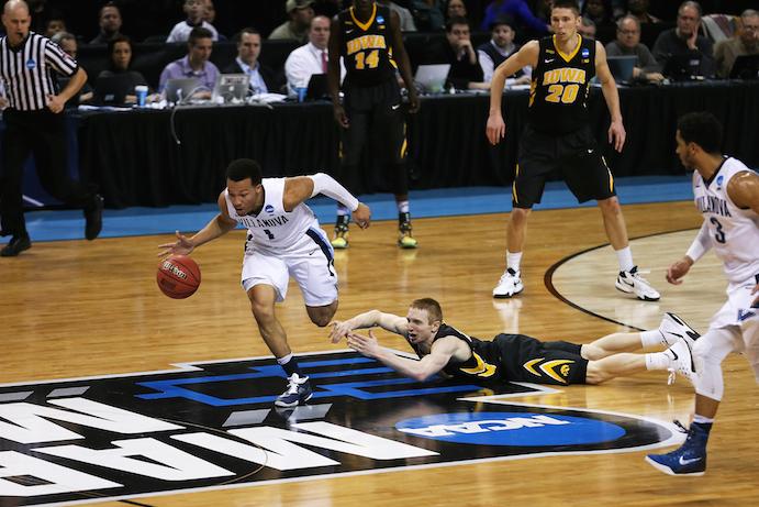 Iowa's Mike Gesell watches as Villanova's Jalen Brunson runs out a fast break. The Wildcats beat the Hawkeyes 87-68 on March 20 at the Barclays Center in Brooklyn, New York (Daily Iowan/Josh House)