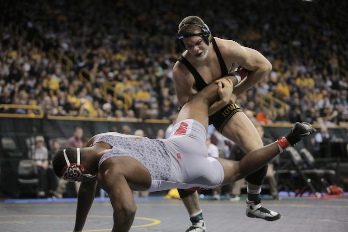 Iowa 197-pounder Nathan Burak throws Ohio States Mark Martin during the Big Ten Championships at Carver-Hawkeye Arena on Saturday, March 5, 2016. After the first session, Iowa is in second place with 68 points. (The Daily Iowan/Valerie Burke)