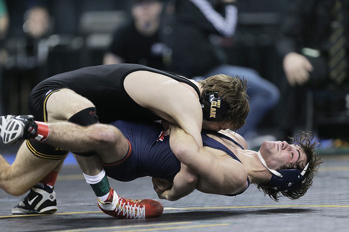 Iowa 133-pounder Cory Clark throws down Illinois Zane Richards during the championship match of the Big Ten Championships at Carver-Hawkeye Arena on Sunday, March 6, 2016. Clark defeated Richards in overtime 2-1. (The Daily Iowan/Valerie Burke)