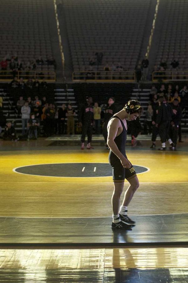 Iowas Thomas Gilman prepares for his match against NC States Sean Fausz during the NWCA National Duels Championship series on Monday, Feb. 22, 2016 in Carver-Hawkeye. Gilman defeated Faus in a 15-5 major decision. (The Daily Iowan/Brooklynn Kascel)