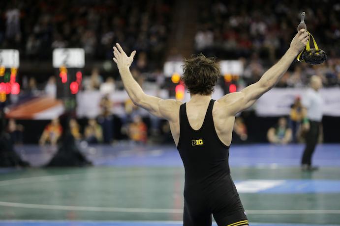 Iowa 125-pounder Thomas Gilman celebrates his semifinal pin of Ohio States Nathan Tomasello during the NCAA Championships at Madison Square Garden in New York City on Friday, March 18, 2016. Gilman pinned Tomasello 37 seconds into overtime. (The Daily Iowan/Valerie Burke)