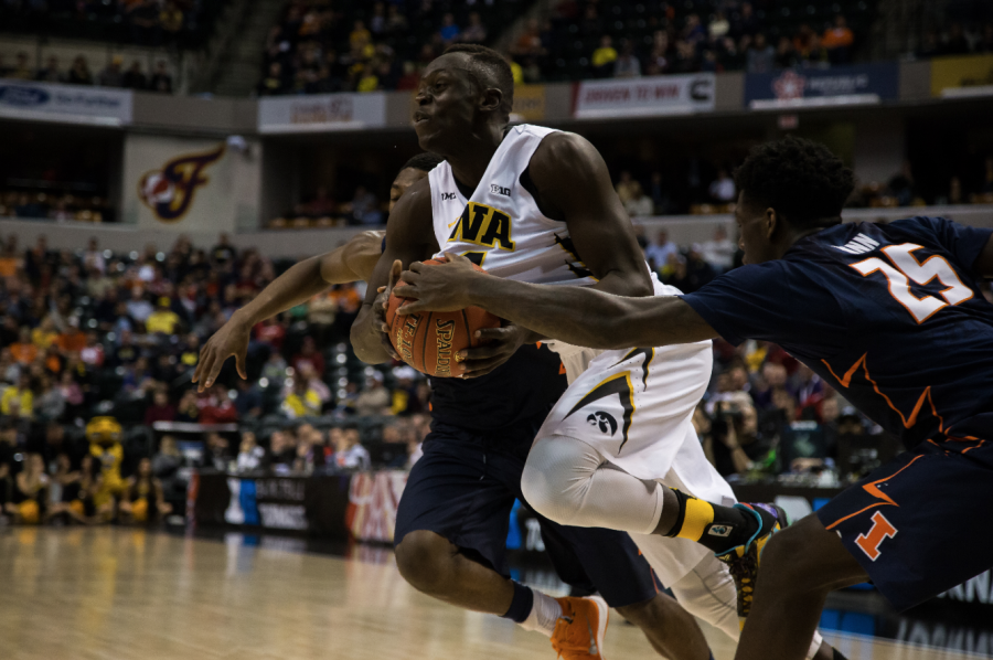 Iowa guard Peter Jok drives past Illinois guard Kendrick Nunn during the Big Ten Tournament game in Indianapolis on Thursday. The Hawkeyes lost their first conference tourney yet again. (The Daily Iowan/Anthony Vazquez)