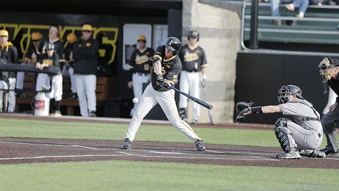 Iowa outfielder Robert Neustrom makes contact at Duane Banks Field in Iowa City on Tuesday, March 29, 2016. The Hawkeyes bats came alive in their 12-3 defeat over the Huskies. (The Daily Iowan/ Alex Kroeze)
