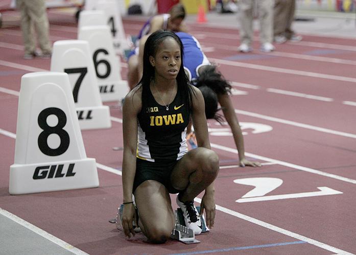 Iowa sprinter Elexis Guster prepares for the 200 meter dash during the Big 4 Duals at the Lied Recreation Athletic Facility in Ames, IA on Saturday, Jan. 24, 2015. Guster won the event with a time of 24.33. The Iowa men took first in the meet, and the women came in second behind UNI. (The Daily Iowan/John Theulen)