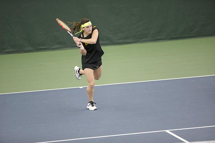 Iowa player Annette Dohanics hits the ball back to UNI player Astrid Santos at the Hawkeye Tennis and Recreation Complex on Feb 26, 2016. The Hawkeye girls tennis team is 7-0 after this match. (The Daily Iowan/Karley Finkel)
