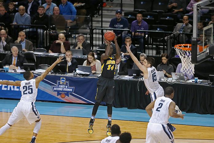 Iowa Hawkeyes guard Peter Jok (14) shoots an open three against the Villanova Wildcats in the Barclays Center on Sunday, March 20, 2016 in Brooklyn, New York. Jok ended the game with 6 rebounds and 11 points. The Wildcats defeated the Hawkeyes, 87-68. (The Daily Iowan/Joshua Housing)
