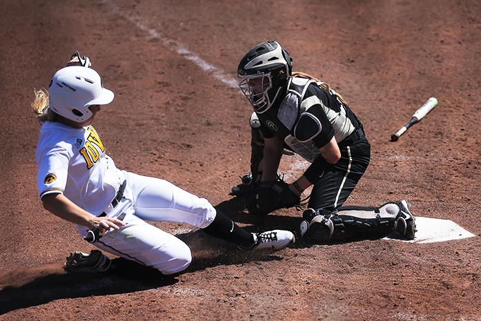 Iowa outfielder Sammi Gyerman gets tagged out at home by Purdue catcher Heather Knight during game three of the Iowa-Purdue series at Bob Pearl Field on Sunday, April 3, 2013. The Hawkeyes won over the Boilermakers, 10-3. (The Daily Iowan/Margaret Kispert)