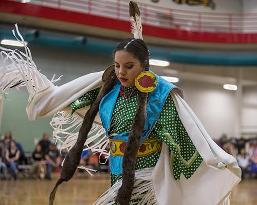 Dancers dance to the music at Field House, Iowa City,  on Saturday, Apr 16, 2016. The event was held by the Native American Student Association to celebrate American Indian song and dance. (The Daily Iowan/Peter Kim)