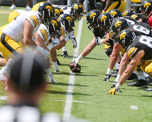 Both Iowa teams lineup for the first snap during the Spring Game at Kinnick Stadium on April 23. The defense beat the offense, 20-18. (The Daily Iowan/Alex Kroeze)