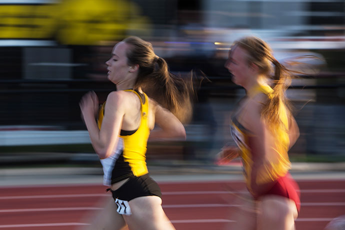 Iowas Tess Wilberding runs during the Musco Twilight at Cretzmeyer Track on April 23. Musco  brings in track and field athletes from all over Iowa to compete for Iowa City fans. (The Daily Iowan/Anthony Vazquez)