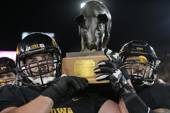 Iowa players carry Floyd the big off the field during the Iowa-Minnesota game at Kinnick on Saturday, Nov. 14, 2013. The Hawkeyes defeated the Golden Gophers, 40-35 to stay perfect on the season. (The Daily Iowan/File photo)