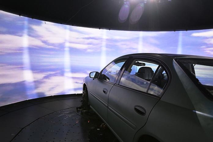 The+National+Advanced+Driving+Simulator+projector+is+shown+on+Tuesday%2C+April+5%2C+2016.+The+simulator+creates+realistic+360+degree+street+views+of+Iowa+City.+%28The+Daily+Iowan%2FTawny+Schmit%29