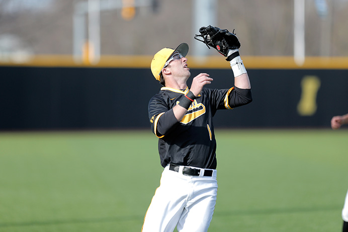 Iowa infielder Mason McCoy catches a pop fly at Banks Field on March 29. The Hawkeyes bats came alive in their 12-3 win over the Huskies. (The Daily Iowan/ Alex Kroeze)