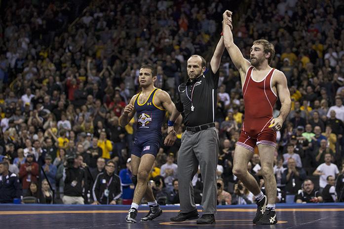 Mens freestyle 57 kg Dan Dennis gets his hand raised after beating fellow Iowa alumn Tony Ramos during the campionship round of the Olympic wrestling trials in Carver Hawkeye on Sunday, April 10, 2016. Dennis defeated Ramos in two straight matches to represent the USA in Rio this summer. (The Daily Iowan/Anthony Vazquez)