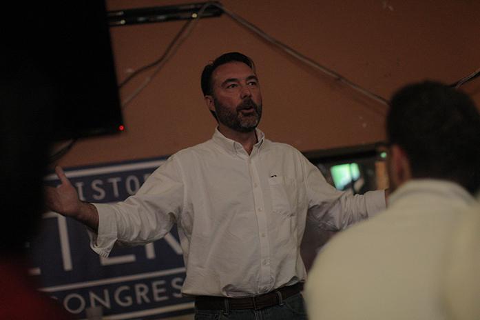 Christopher Peters, who is running as the GOP candidate for the second congressional district, talks with Iowa students during a meet and greet inside Airliner on Tuesday, April 19. Peters was formerly part of the libertarian party. (The Daily Iowan/Brooklynn Kascel)