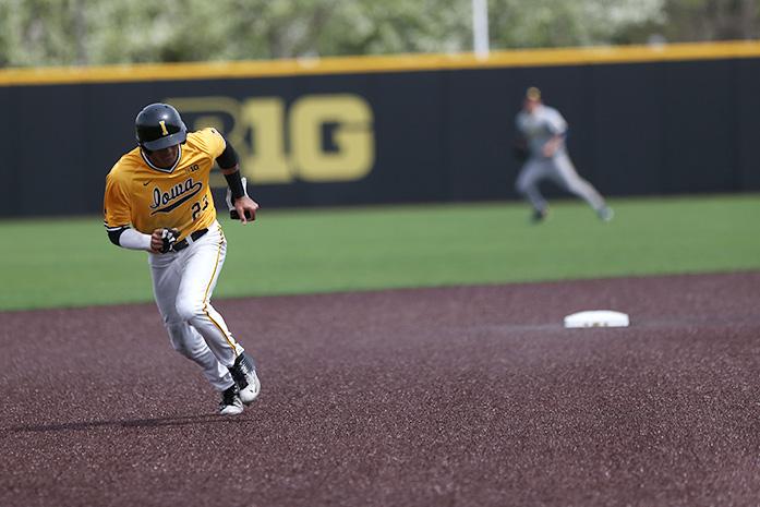 Iowa+center+fielder+Joel+Booker+runs+to+third+base+during+game+three+of+the+Iowa-Michigan+series+at+Duane+Banks+Field+on+Sunday%2C+April+24%2C+2016.+The+Hawkeyes+defeated+the+Wolverines%2C+8-3.+%28The+Daily+Iowan%2FMargaret+Kispert%29