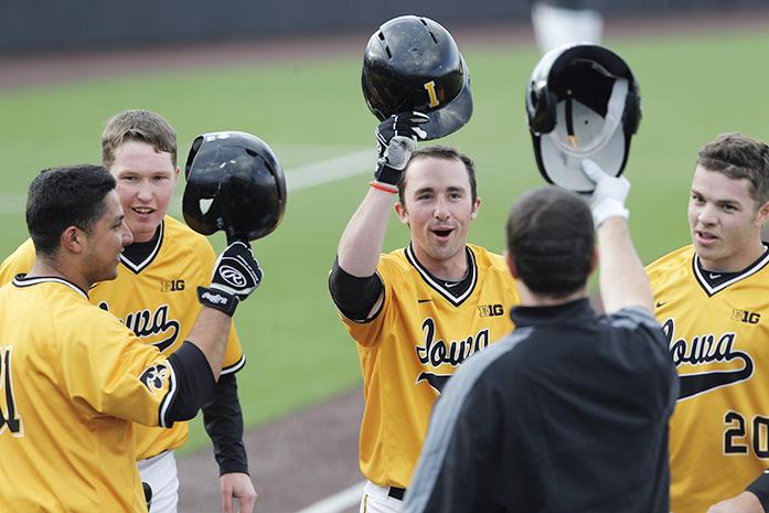 Iowa infielder Mason McCoy celebrates with teammates after a home run at Duane Banks Field on Wednesday, April 6, 2016. The Hawkeyes only allowed 2 hits as they went on to beat the Panthers 9-1. (The Daily Iowan/ Alex Kroeze)