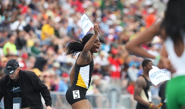 Iowa runner Brittany Brown celebrates after the womens 4 x 100 meter relay at Drake Stadium on Saturday, April 26, 2014. Iowa won first place in this event. (The Daily Iowan/Joshua Housing)