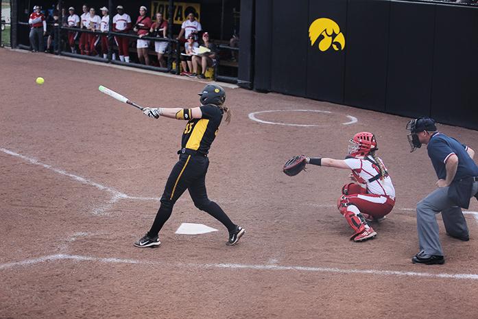 Iowa catcher Holly Hoffman hits the ball during the Iowa-Wisconsin game at Bob Pearl Field on Saturday, April 16, 2016. Hoffman had 2 RBIs today for 3 at bats. The Hawkeyes defeated the Badgers 5-2. (The Daily Iowan/Valerie Burke)