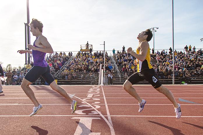 Iowas Carter Lilly is narrowly beaten by Nikes Erik Sowinski during the Musco Twilight event at Francis X. Cretzmeyer Track on Saturday, April 23, 2016. The Musco Twilight brings in track and field athletes from all over Iowa to compete for Iowa City fans. (The Daily Iowan/Anthony Vazquez)