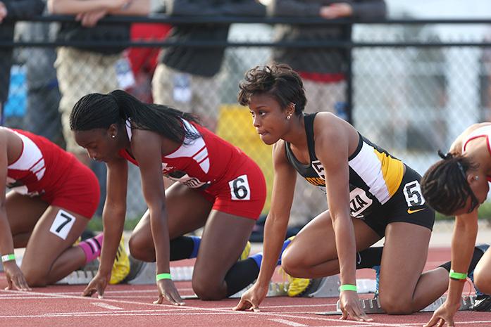 Iowa runner Lake Kwaza prepares for the womens 100 meter dash at the Iowa Musco Invitational in Iowa City on Saturday, May 3. Kwaza placed second in the event. (The Daily Iowan/Rachael Westergard)